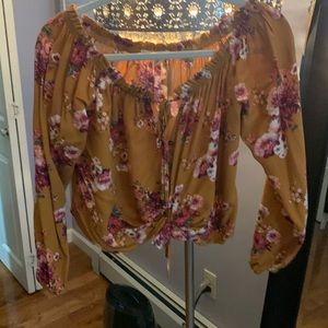 Caramel colored cropped blouse with flower detail!